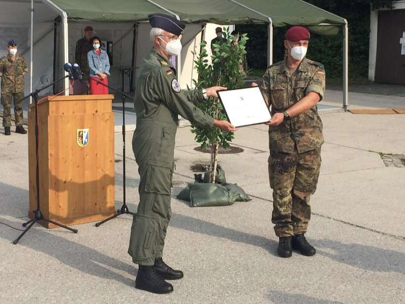 The Commander EATC awards an EATC certification to a German training facility